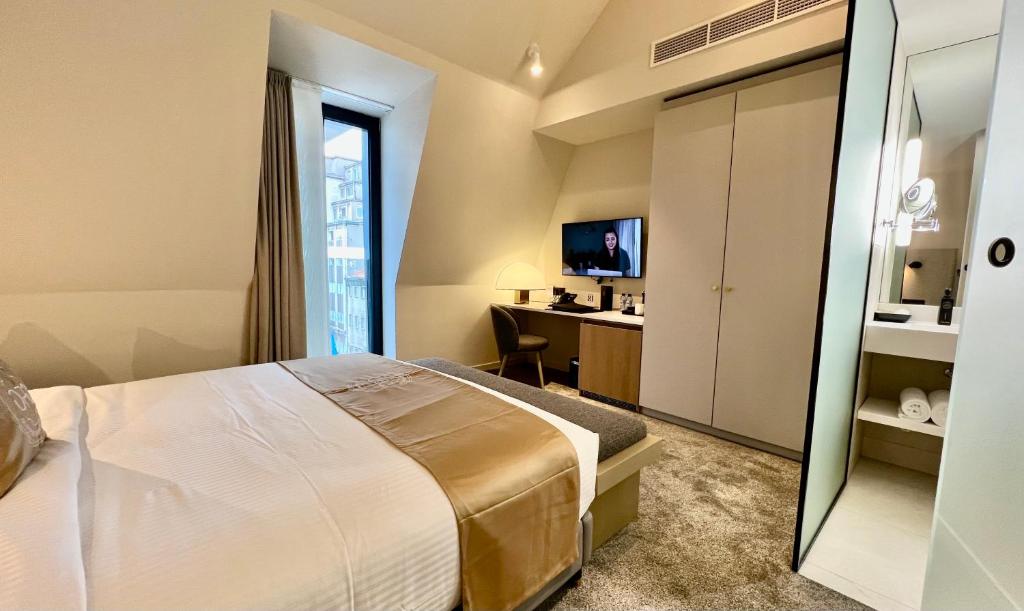 Postel nebo postele na pokoji v ubytování OPO Hotel
