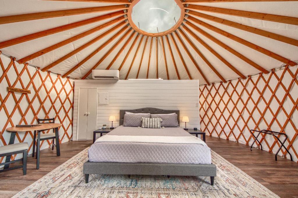 a bedroom with a bed in a yurt at OT 3515A Texas Yurt Haus Armadillo in New Braunfels