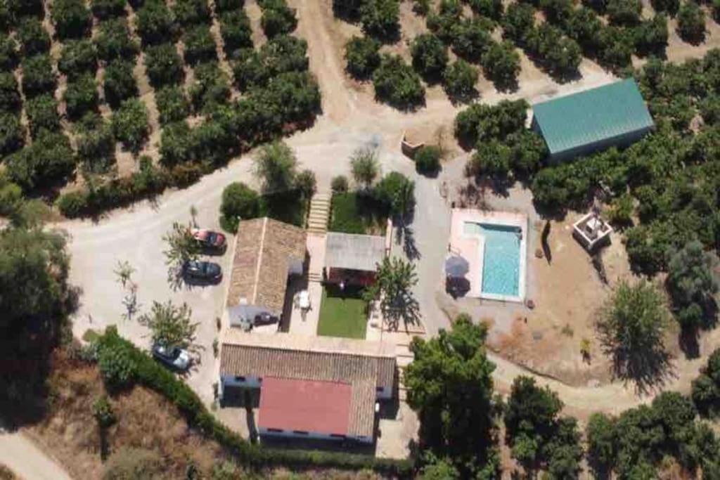 an aerial view of a house with a swimming pool at Casa rural La Liñana in Córdoba