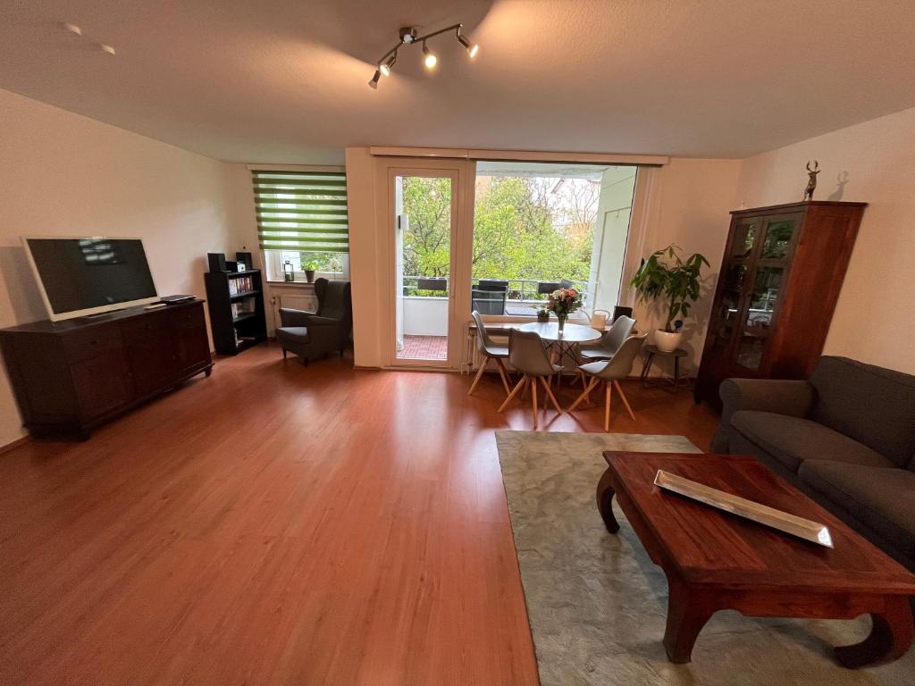 a living room with a couch and a table at Luchsury Appartment in Bad Harzburg