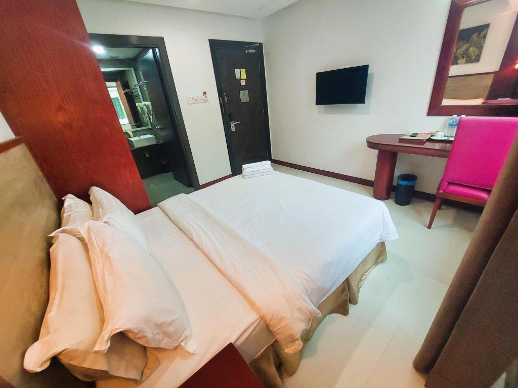 Postel nebo postele na pokoji v ubytování Celyn City Hotel