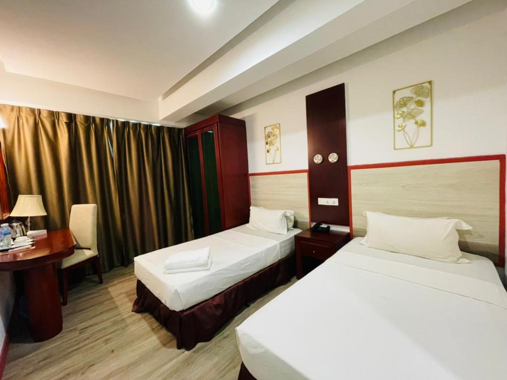 Postel nebo postele na pokoji v ubytování Celyn City Hotel