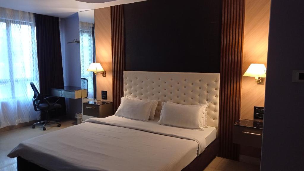 A bed or beds in a room at The Grand Hotel