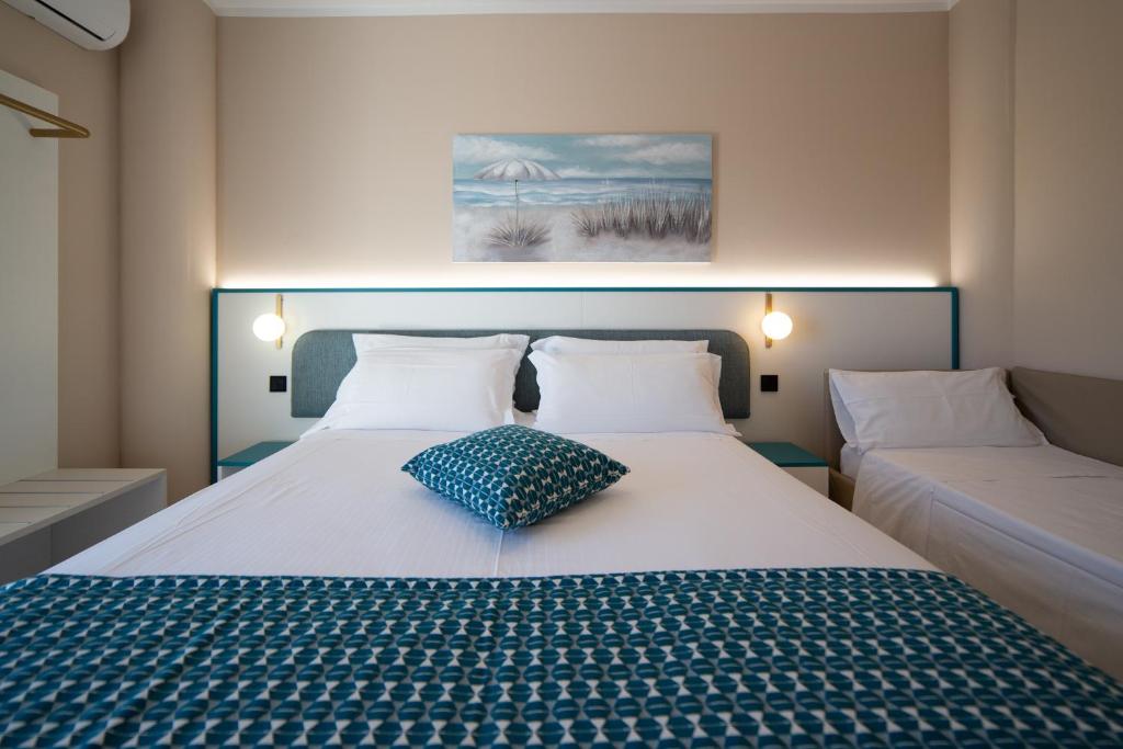 Postel nebo postele na pokoji v ubytování Hotel Sporting