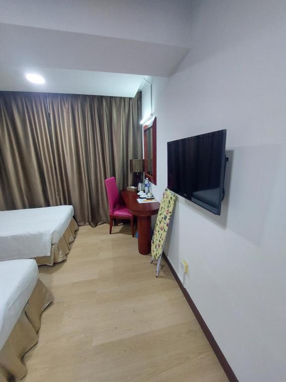 TV a/nebo společenská místnost v ubytování Celyn City Hotel