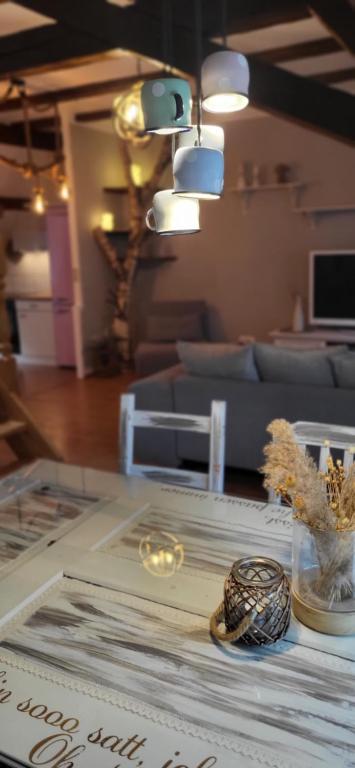 a glass table with some items on it in a living room at Altstadt-Liebe in Neuanbau