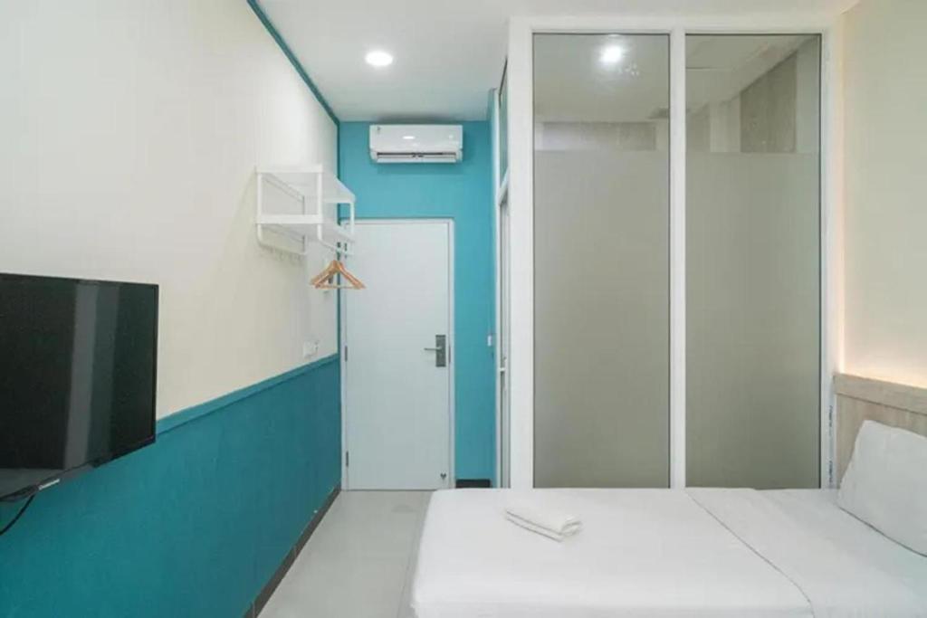 Behomy 3C Residence near ICE BSD客房内的一张或多张床位