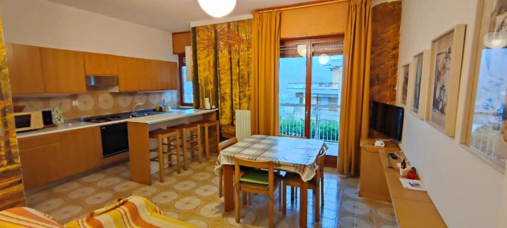 a kitchen with a table and a dining room at Casa Giada in Rapallo