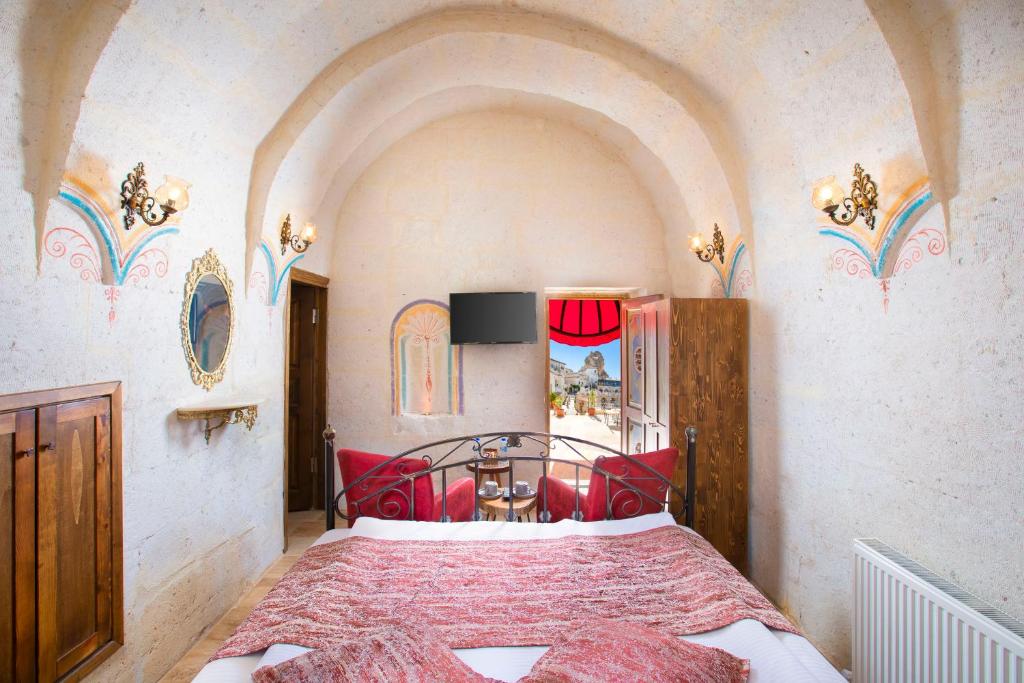 Postel nebo postele na pokoji v ubytování Carna Cave Hotel Cappadocia