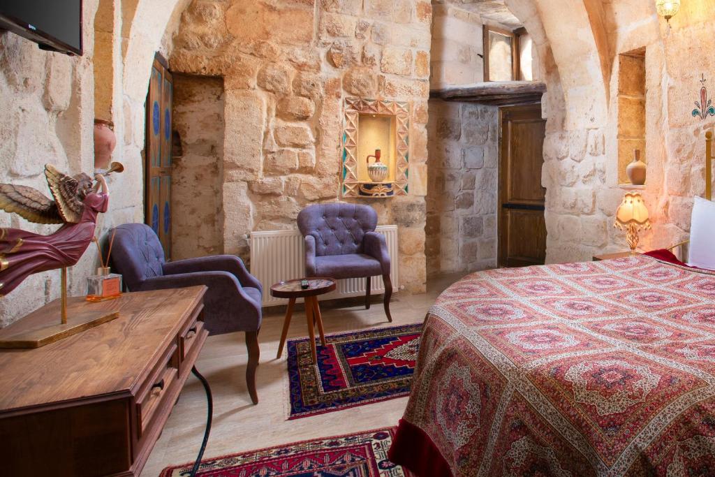 Postel nebo postele na pokoji v ubytování Carna Cave Hotel Cappadocia