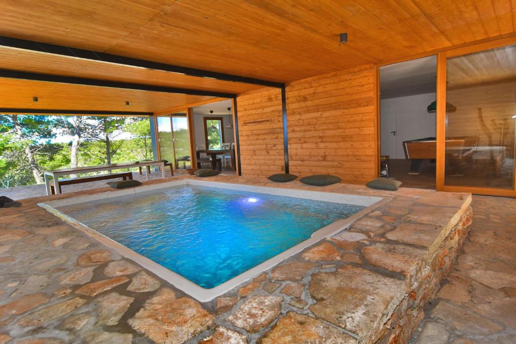 an indoor swimming pool in a house at Villa Vela Baraka - Happy Rentals in Dragove