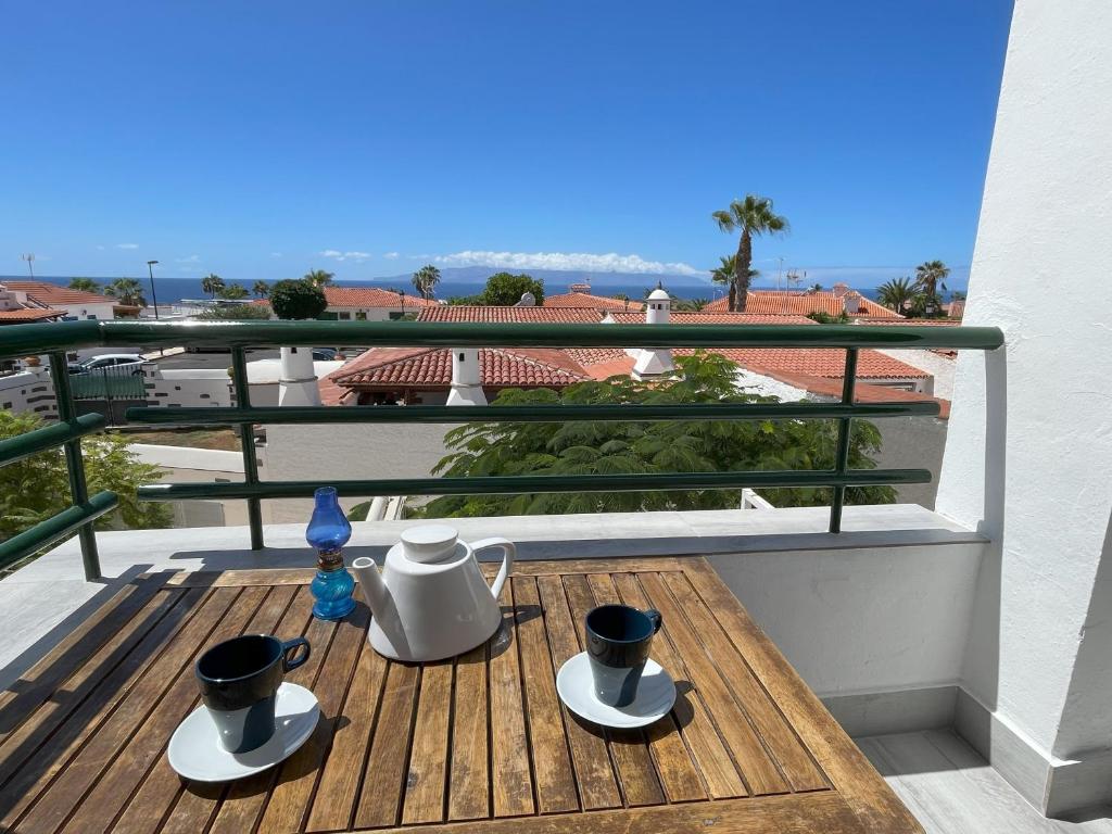 a balcony with two pots and pans on a table at Newly renovated apartment with 2 terrace, 2 bedroom, 5min beach in Puerto de Santiago