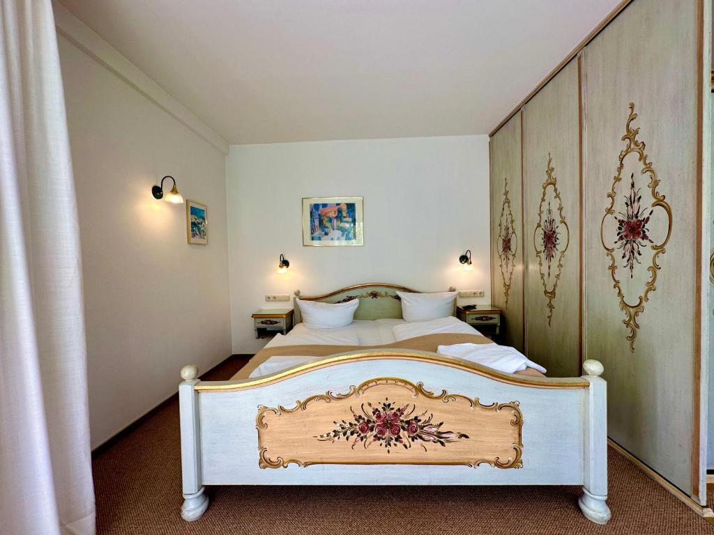 Postel nebo postele na pokoji v ubytování Hotel Bergland
