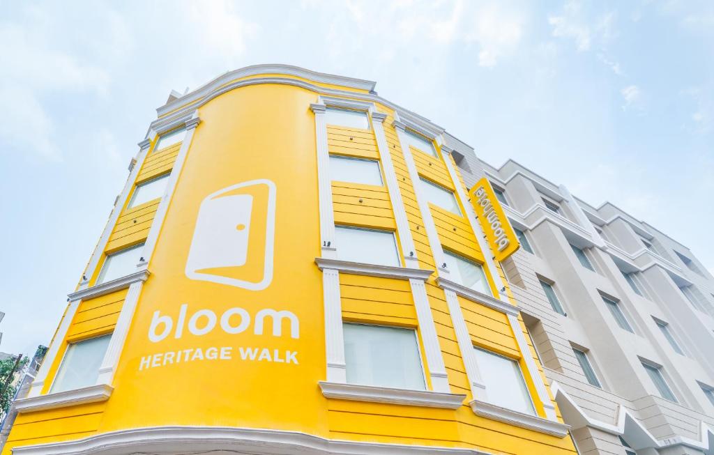 a yellow building with a yellow residence walk sign on it at Bloom Hotel - Heritage Walk in Amritsar