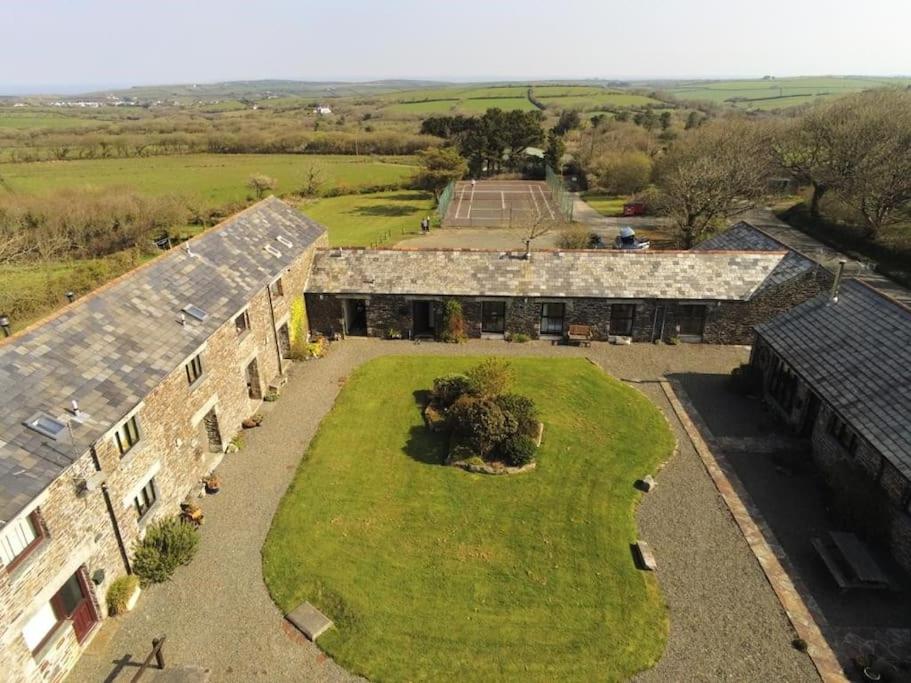 an aerial view of a building with a large yard at The Stables - Crackington Haven Cornwall in Crackington Haven