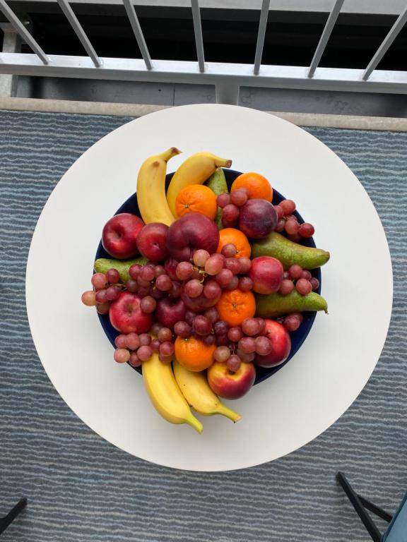 a plate of fruit and vegetables on a table at ApartHotel Faber in Aarhus