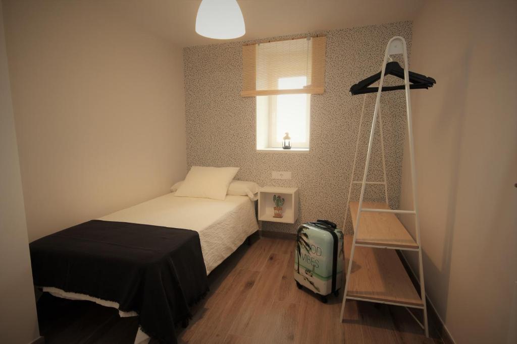 Postel nebo postele na pokoji v ubytování La Casa del Mercat