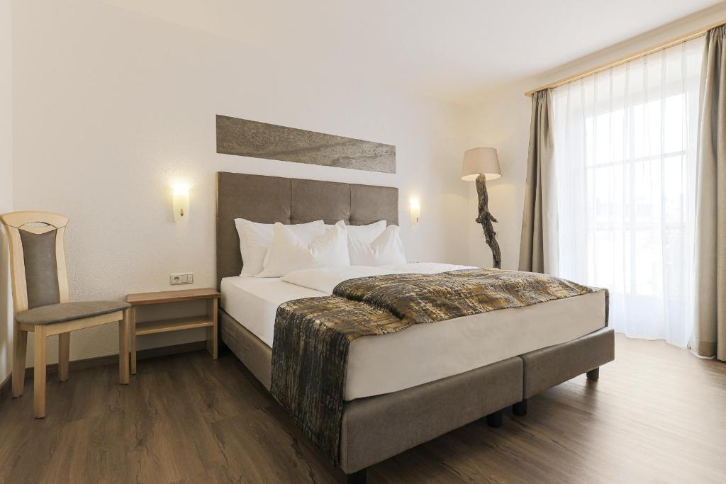 Łóżko lub łóżka w pokoju w obiekcie Residence Kronenwirt