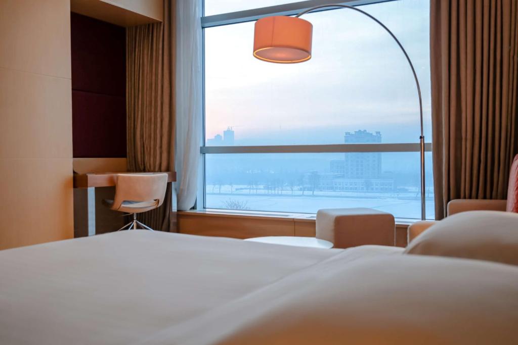 Postel nebo postele na pokoji v ubytování Hyatt Regency Dushanbe