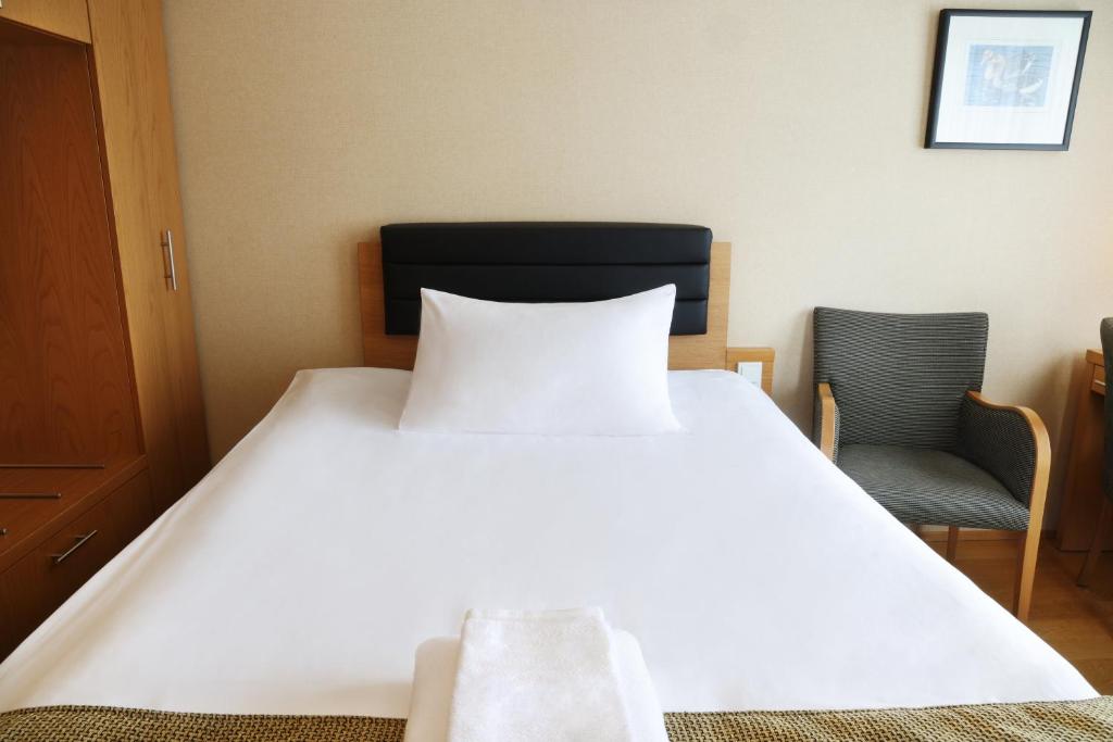 Postel nebo postele na pokoji v ubytování Hotel Reykjavík Centrum