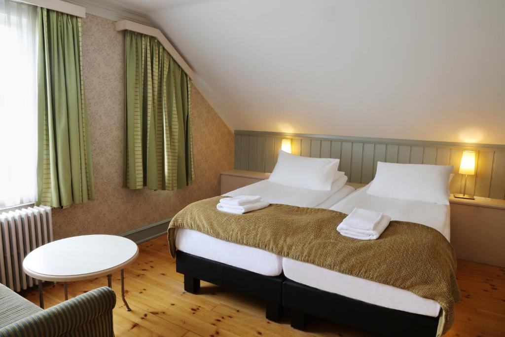 Postel nebo postele na pokoji v ubytování Hotel Reykjavík Centrum