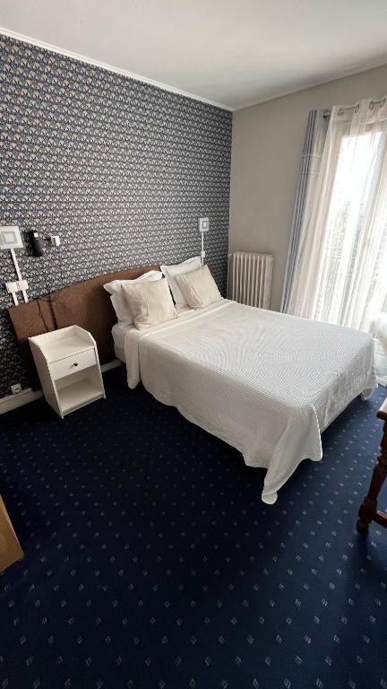 Postel nebo postele na pokoji v ubytování Hôtel Marie Louise