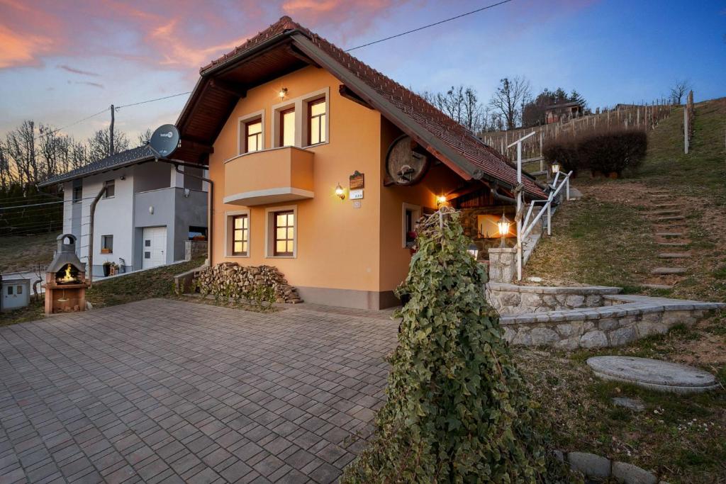 a house with a driveway in front of it at Holiday Home Tramte In Vineyards - Happy Rentals in Škocjan