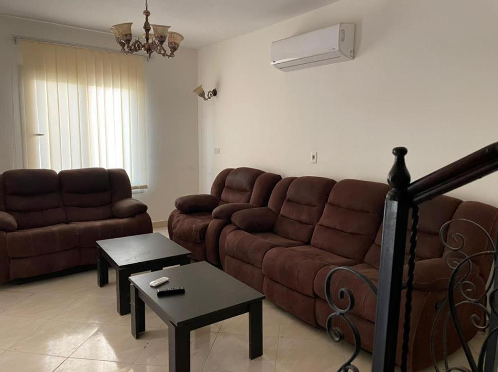 a living room with a couch and a table at العين السخنة in Ain Sokhna