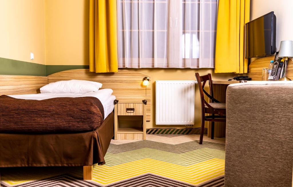 Postel nebo postele na pokoji v ubytování Hotel Texas***