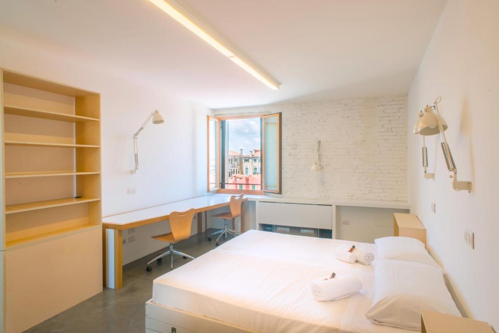 Postel nebo postele na pokoji v ubytování Combo Venezia
