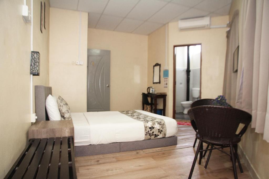 Postel nebo postele na pokoji v ubytování Myra Hotel Mersing