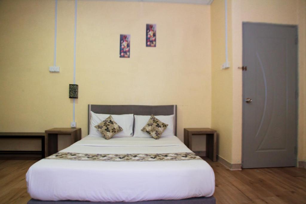 Postel nebo postele na pokoji v ubytování Myra Hotel Mersing