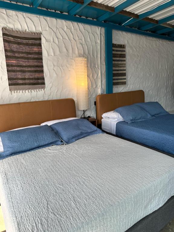 Postel nebo postele na pokoji v ubytování Hotel Casa Lucca