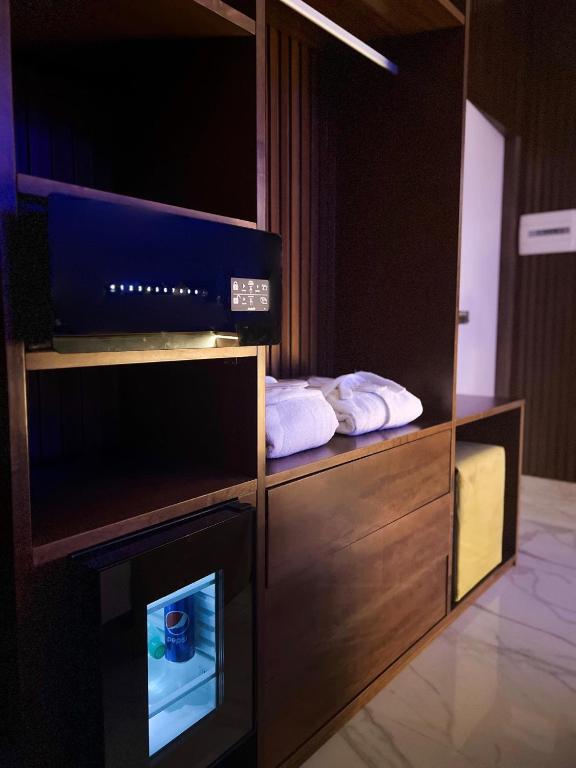 A bed or beds in a room at Hotel Masaniello Luxury
