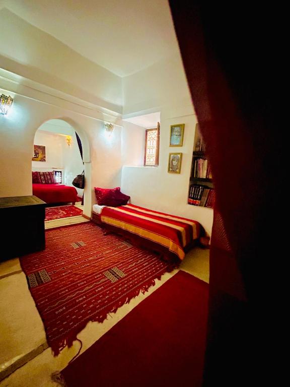 Postel nebo postele na pokoji v ubytování Riad Alamine