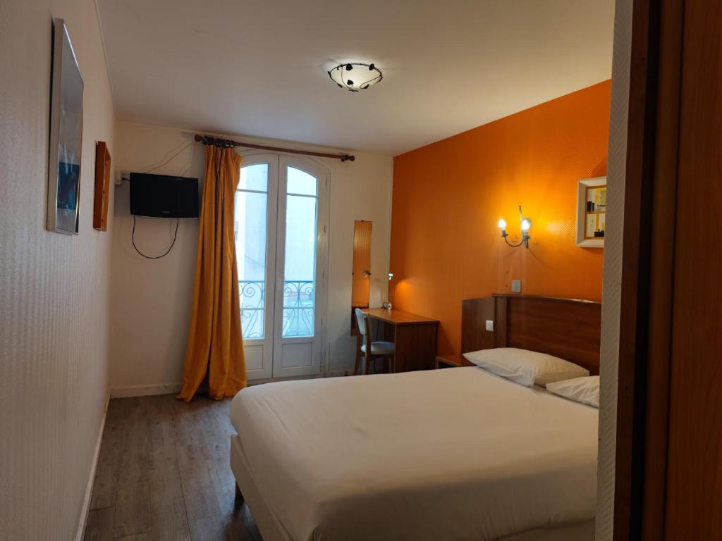 Postel nebo postele na pokoji v ubytování Hôtel Riquet
