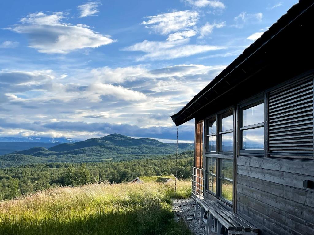 a cabin with a view of the mountains at Veslestølen - Ålhytte with amazing view, 1000 meter in Ål