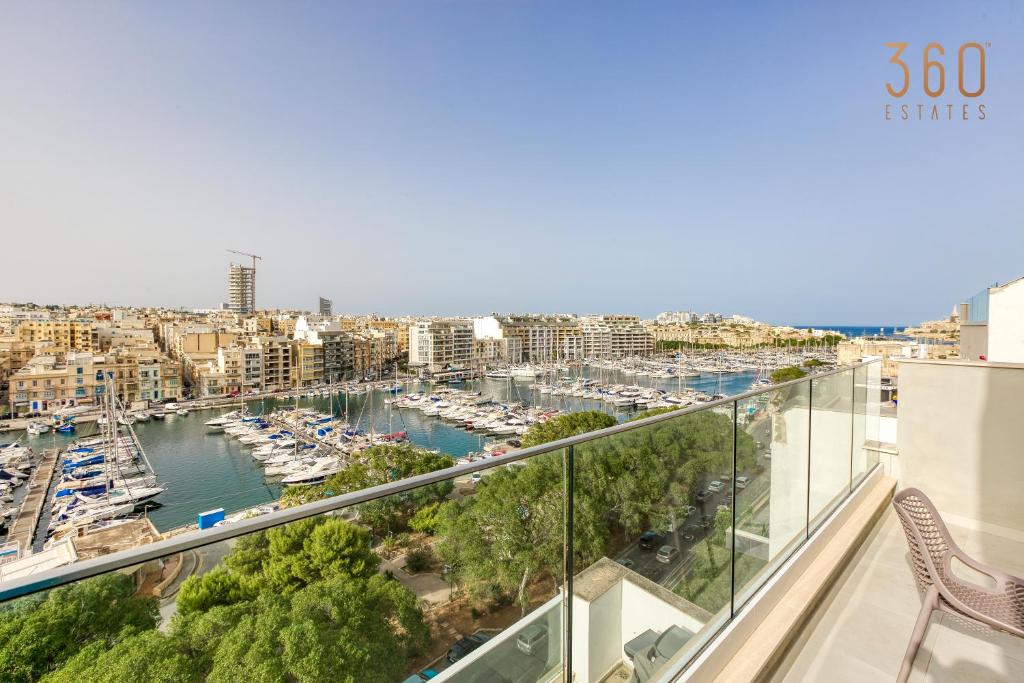 a view of a marina from the balcony of a apartment at Wonderful marina 3BR home, with LUX interior w/AC by 360 Estates in Tal-Pietà