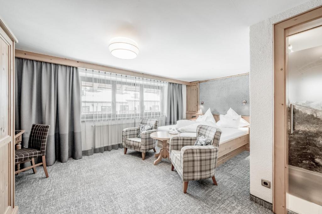 Postel nebo postele na pokoji v ubytování Hotel Jenewein
