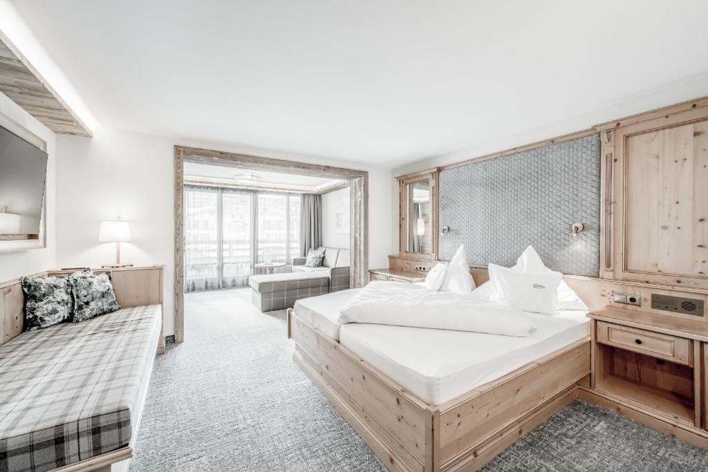 Postel nebo postele na pokoji v ubytování Hotel Jenewein