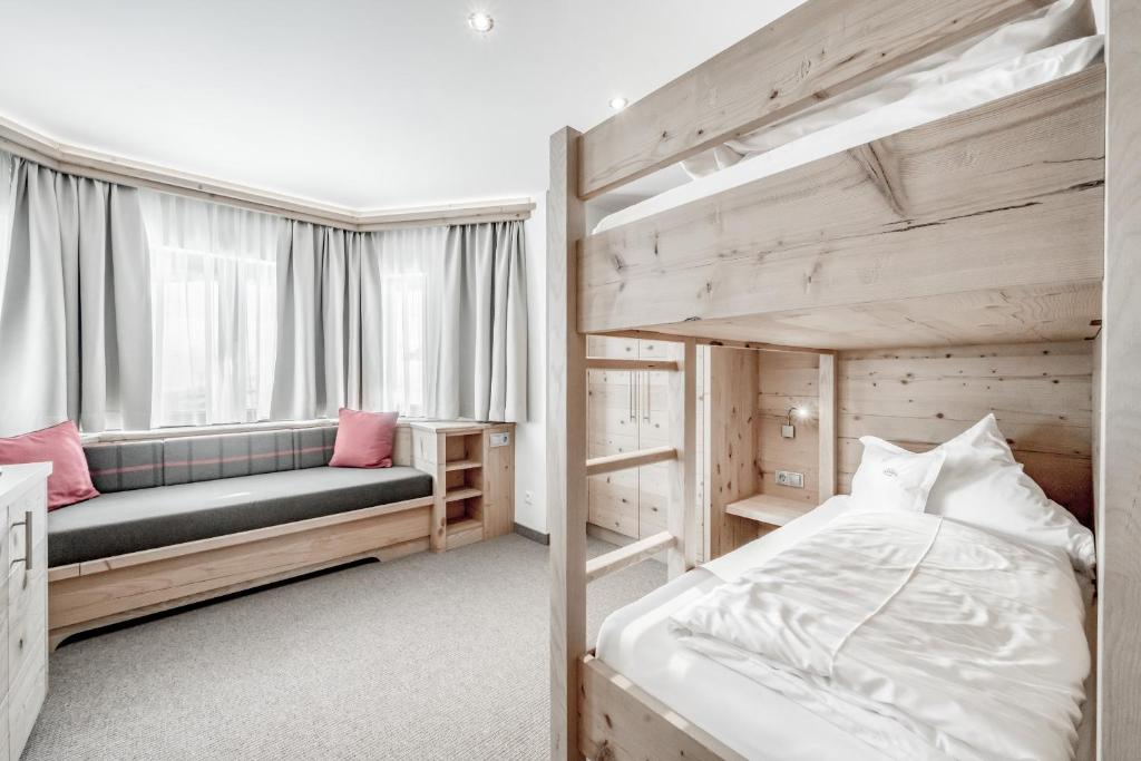 Postel nebo postele na pokoji v ubytování Hotel Jenewein