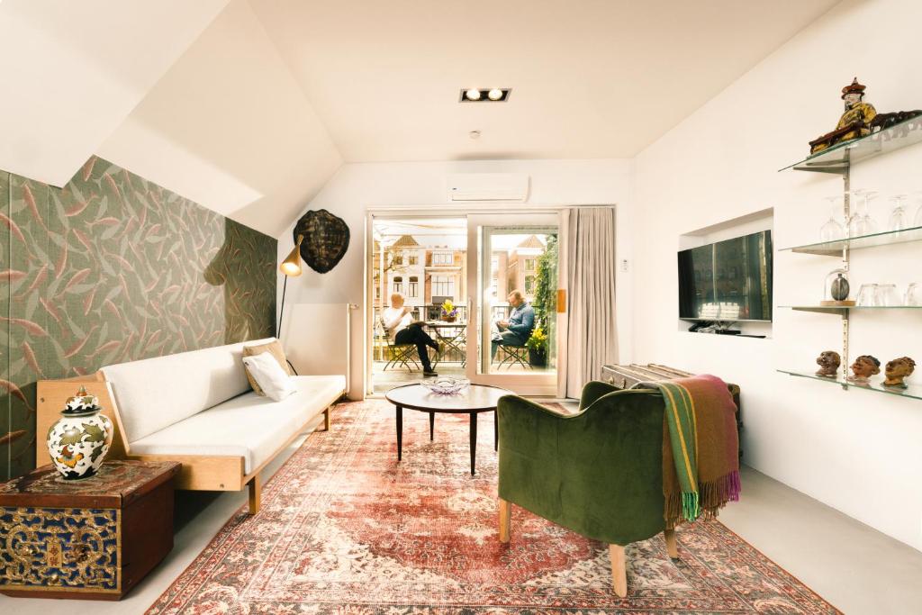 TV a/nebo společenská místnost v ubytování Boutique Hotel Goud En Zilver