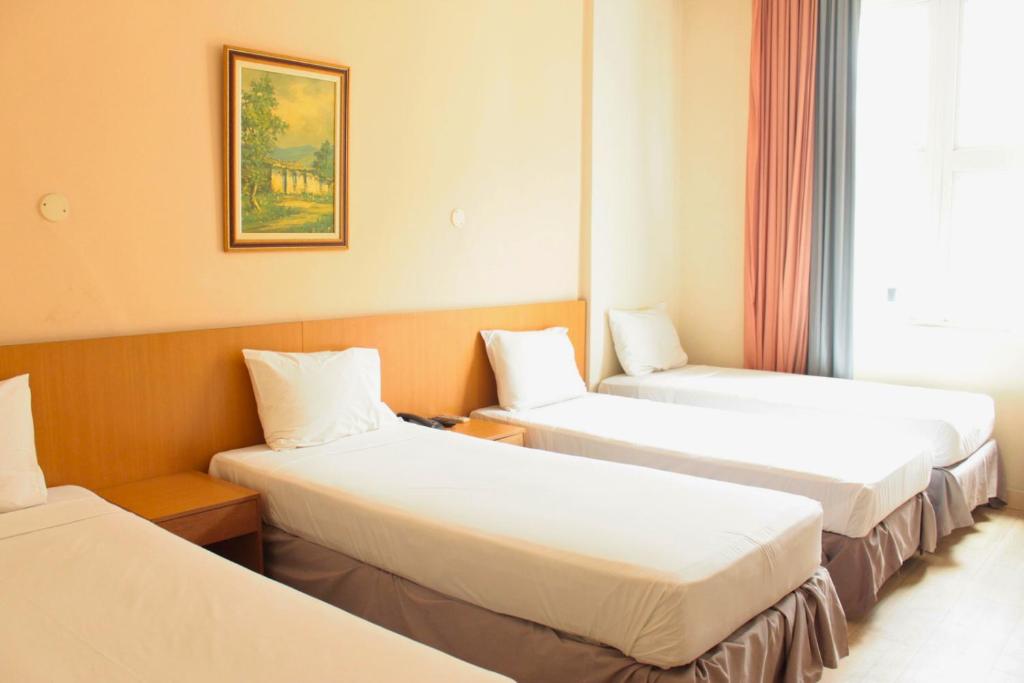 Postel nebo postele na pokoji v ubytování Hotel Atlântico Tower