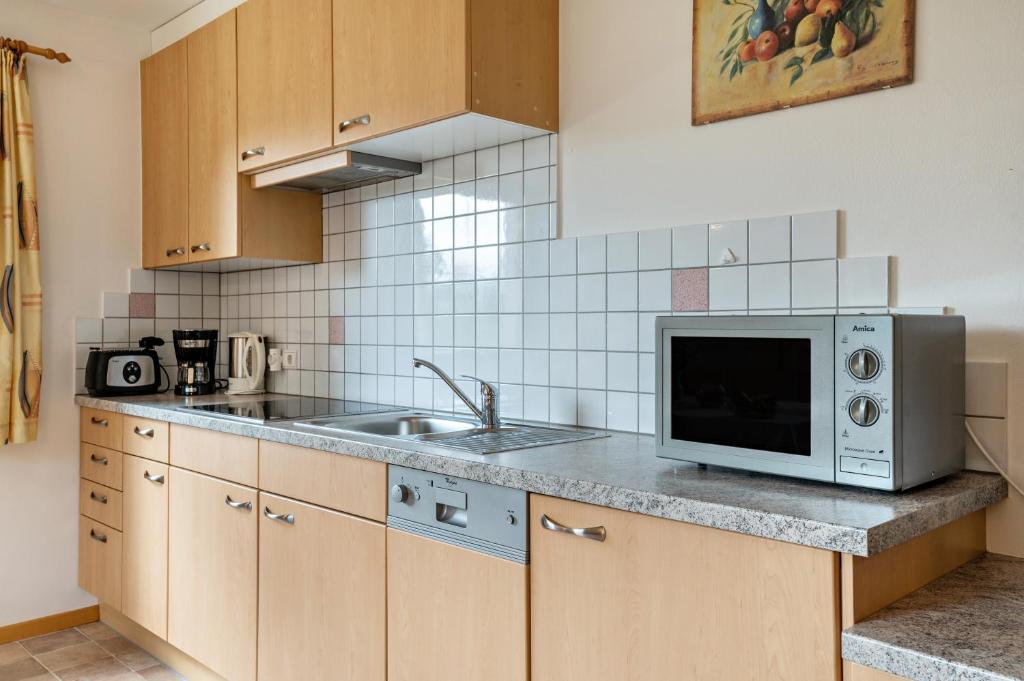 Kuchyň nebo kuchyňský kout v ubytování Obertegghof Wohnung Schartenblick