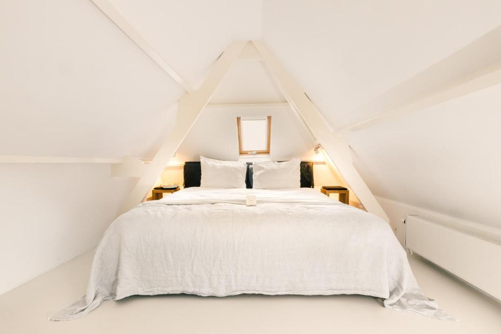 Postel nebo postele na pokoji v ubytování Boutique Hotel Goud En Zilver