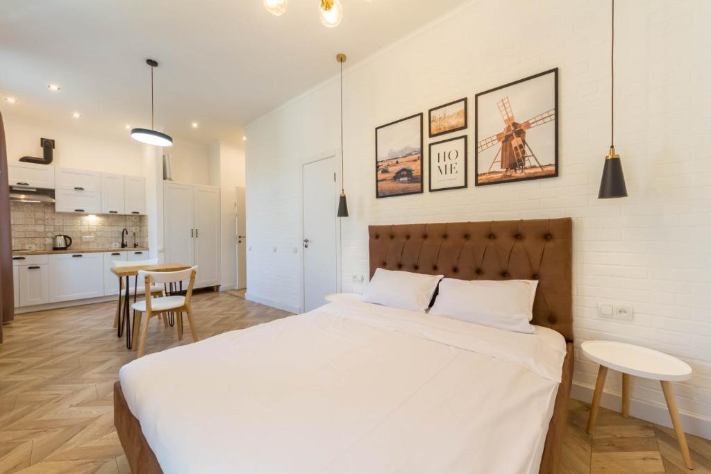 Postel nebo postele na pokoji v ubytování Idea Design Apart-Hotel Chykalenka