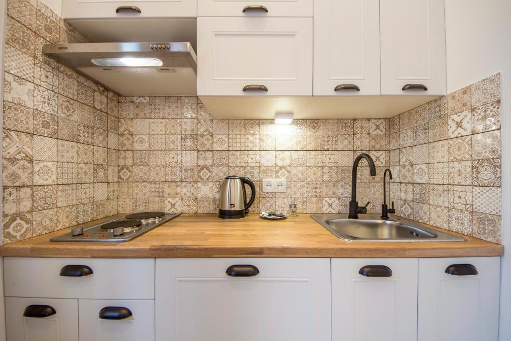 Kuchyň nebo kuchyňský kout v ubytování Idea Design Apart-Hotel Chykalenka