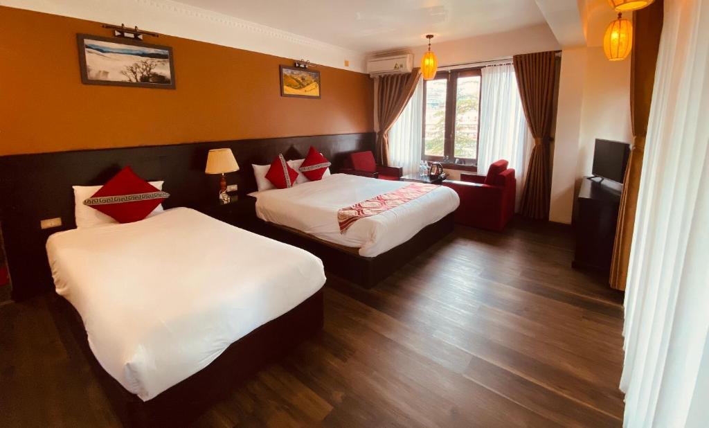 Postel nebo postele na pokoji v ubytování Sapa Elite Hotel