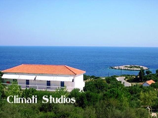 a building with a view of the ocean at Climati Studios in Skinária