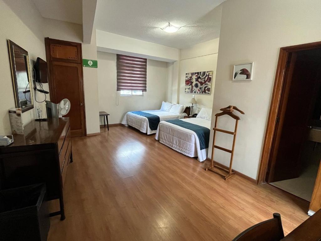 Postel nebo postele na pokoji v ubytování HOTEL TRUEBA